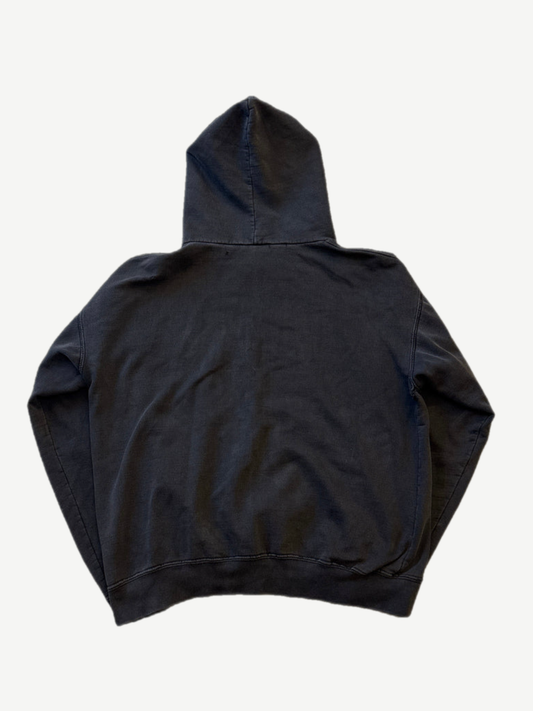 Back of vintage Misfits faded black hoodie showing blank distressed cotton fleece and hood drape