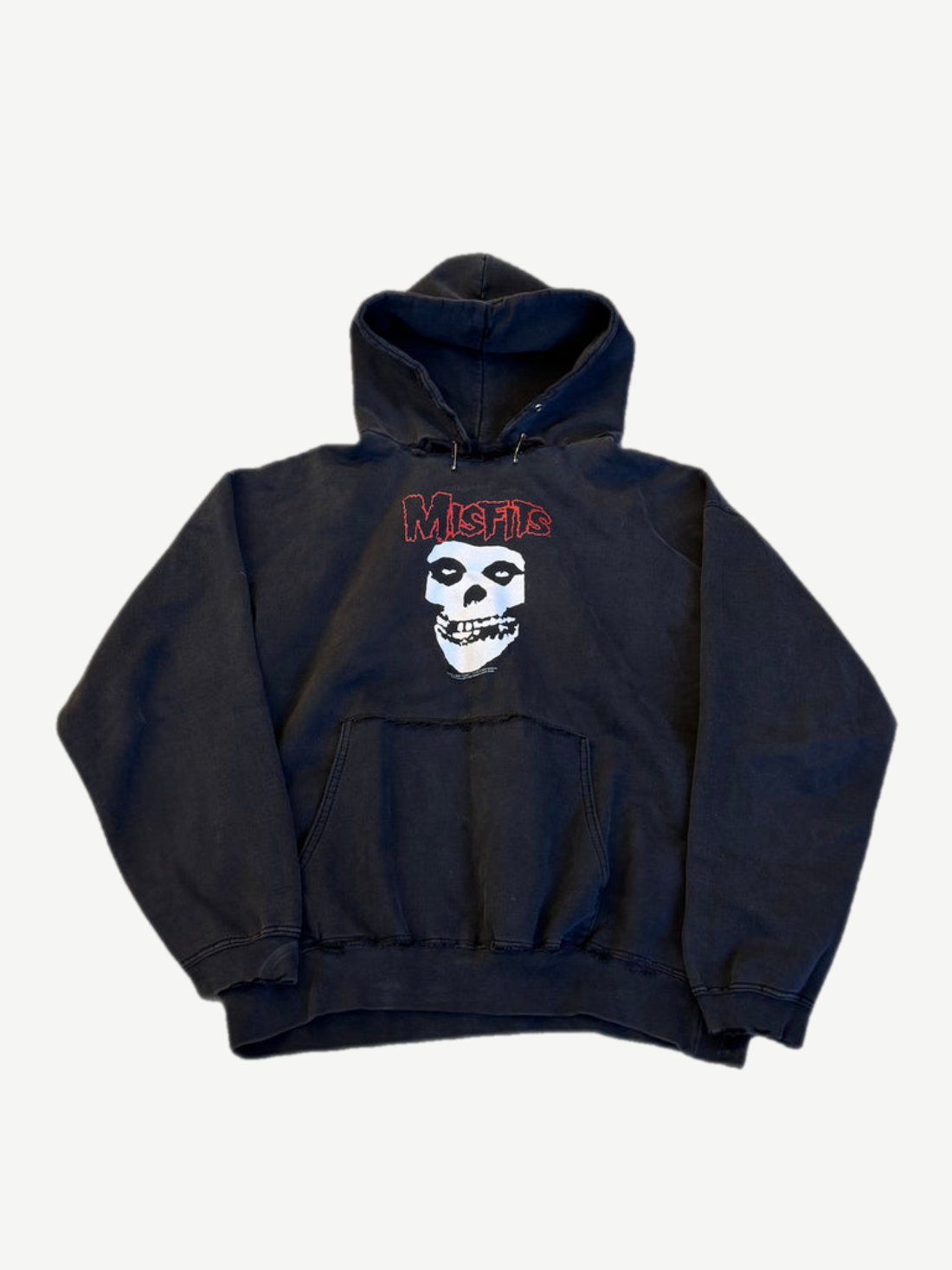 Vintage Misfits faded black pullover hoodie with classic Fiend skull graphic and red logo on chest