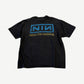 Back of vintage Nine Inch Nails tee with boxed NIN logo and Now I'm Nothing text in blue and gold.