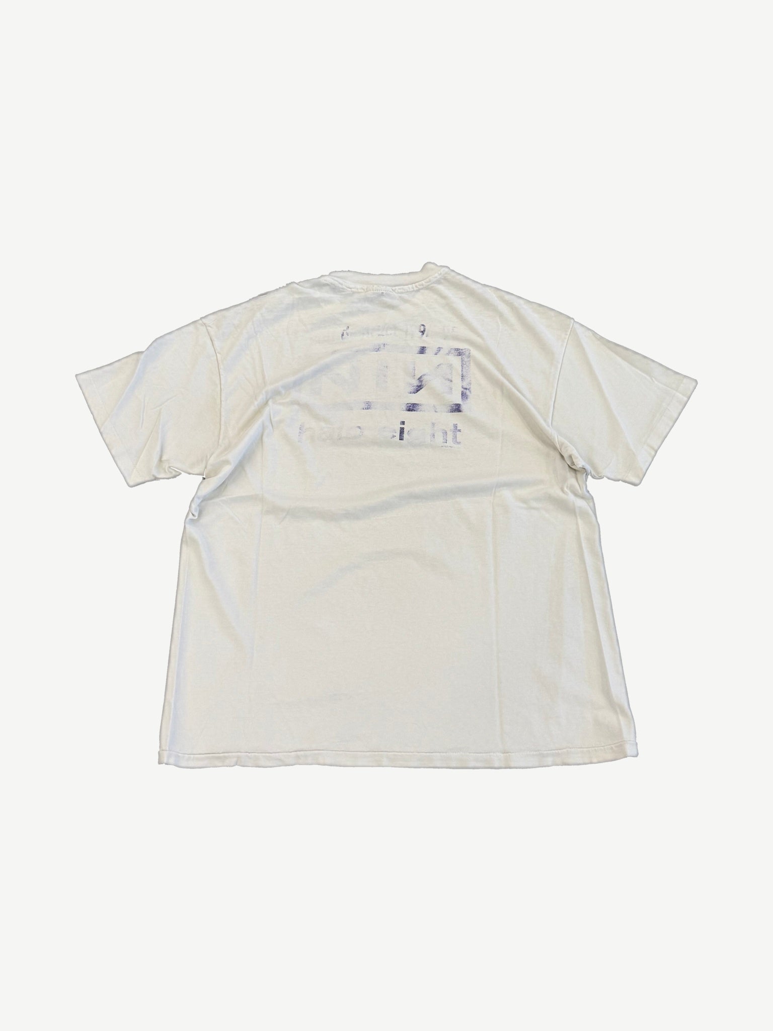 Vintage Nine Inch Nails Downward Spiral tee back view in white with faded reverse print bleed through.