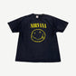 Vintage Nirvana black band tee front with iconic yellow smiley face logo and stencil band name.