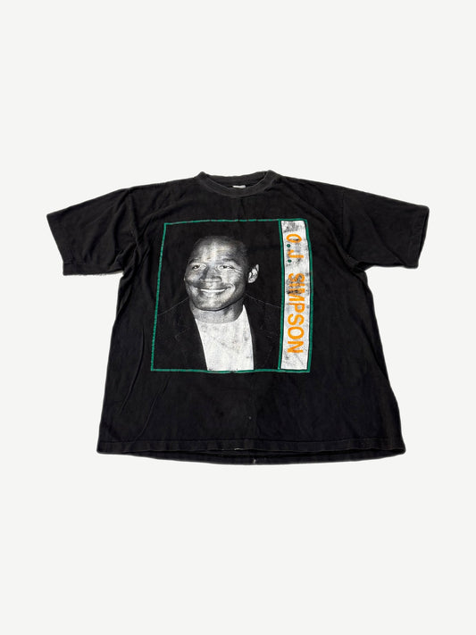 Vintage O.J. Simpson black tee with green-bordered portrait print and orange vertical name text