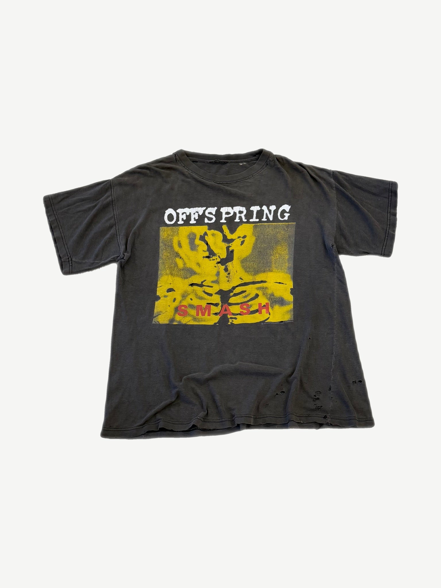 Vintage Offspring Smash album tee in faded black with yellow figure cover art print and distressed hem