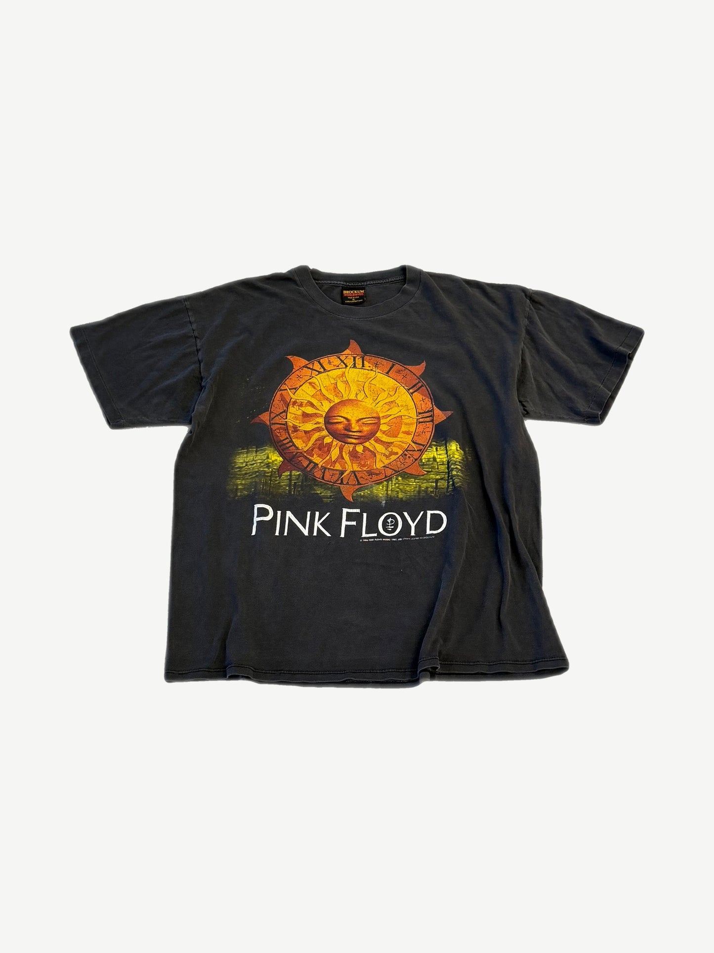 Vintage Pink Floyd 1994 tour tee with orange sun-face roman numeral clock graphic and PINK FLOYD text.