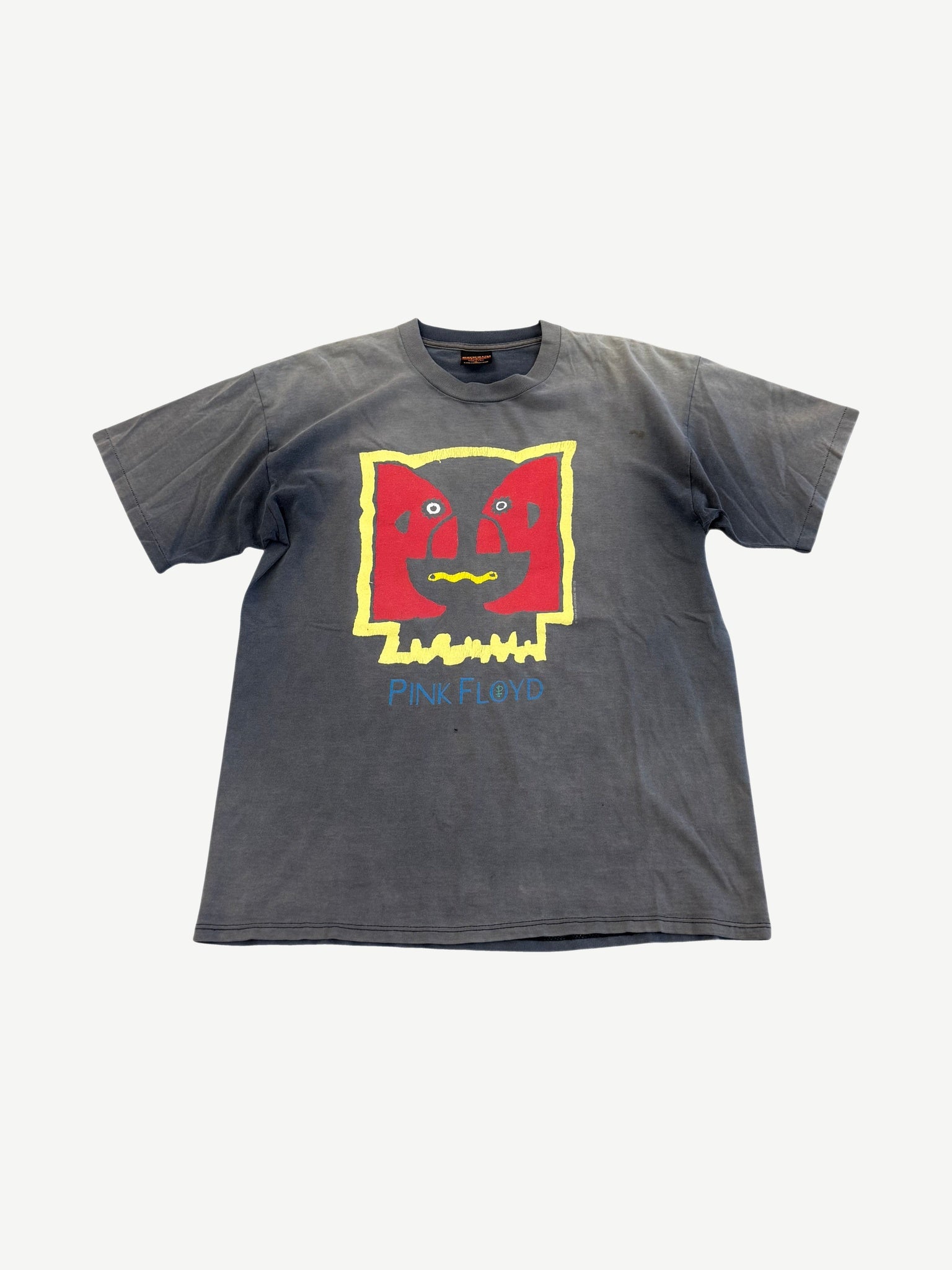 Vintage Pink Floyd faded black Division Bell tour tee with abstract red yellow face graphic and blue logo