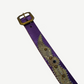 Buckle end of vintage purple studded belt with brass square buckle and embossed snakeskin panel detailing