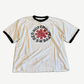 Vintage Red Hot Chili Peppers ringer tee in cream with black collar trim and bold red asterisk band logo