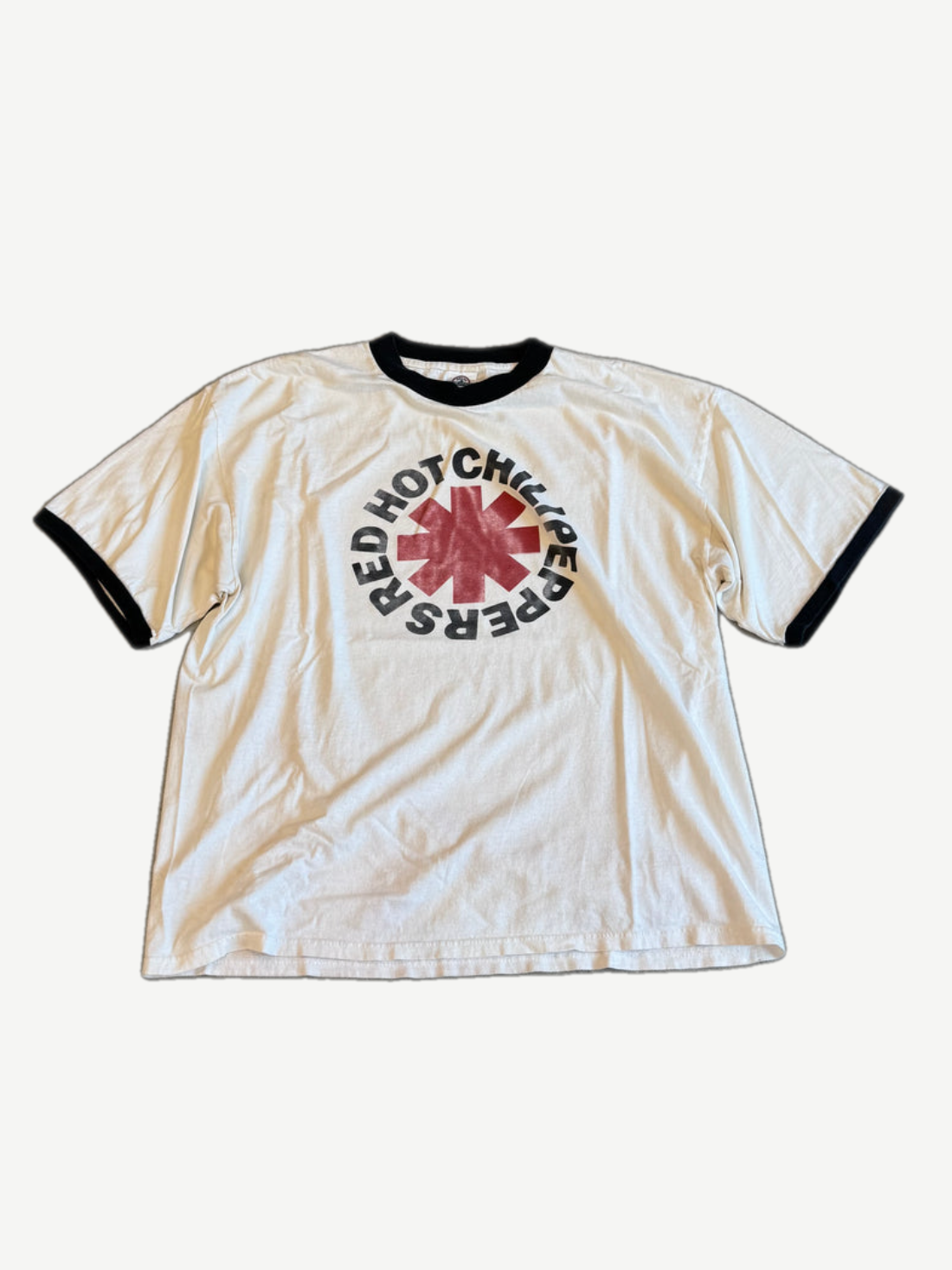Vintage Red Hot Chili Peppers ringer tee in cream with black collar trim and bold red asterisk band logo