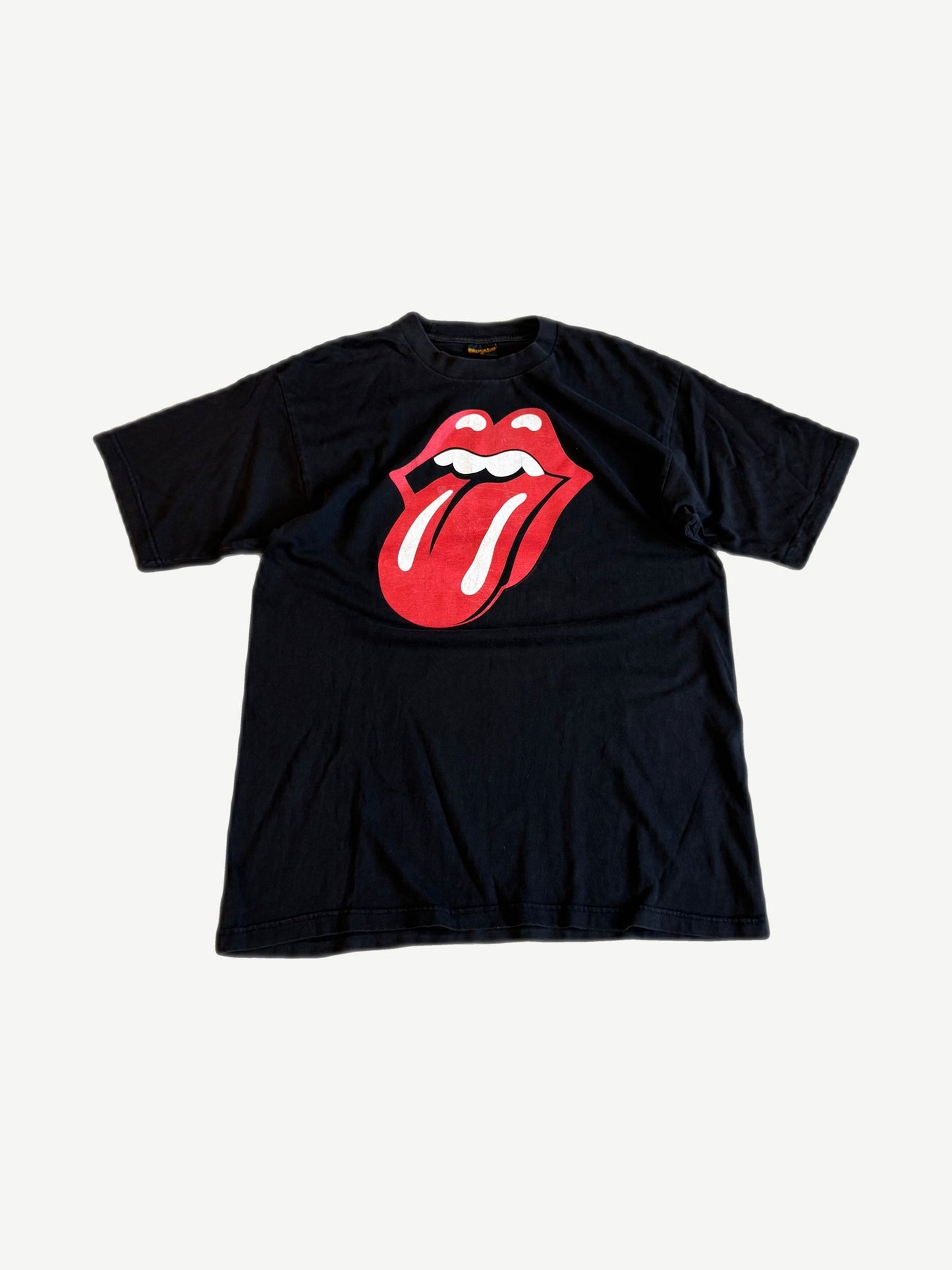 Vintage Rolling Stones black band tee with iconic red tongue and lips logo centered on chest