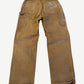 Vintage tan Carhartt double knee carpenter pants back with hammer loop, utility pocket and Carhartt logo patch.