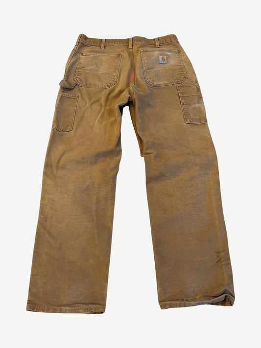 Vintage tan Carhartt double knee carpenter pants back with hammer loop, utility pocket and Carhartt logo patch.