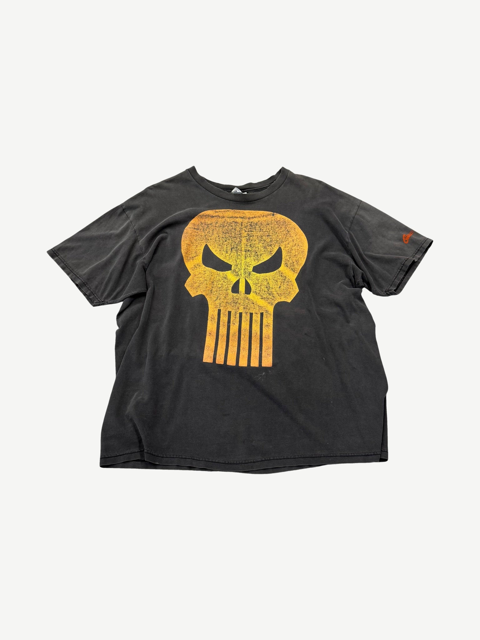 Vintage faded black Punisher tee with large orange distressed skull logo print across the chest