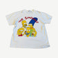 Vintage The Simpsons white tee with red wordmark and family portrait of Homer, Marge, Bart, Lisa, Maggie.