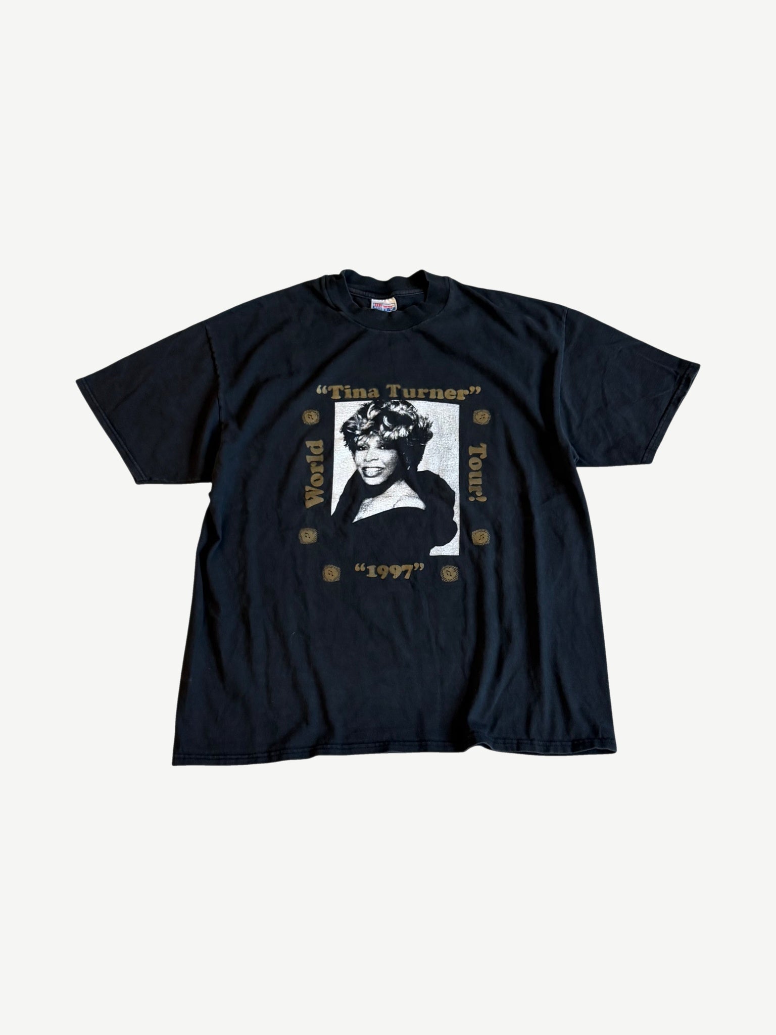 Vintage Tina Turner 1997 World Tour tee front in faded black with gold-framed portrait print and tour text