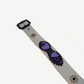 Vintage white studded belt strap detail with purple suede patch, black bead trim and silver concho rivets
