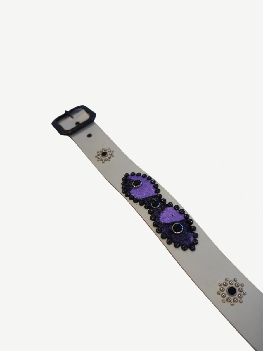 Vintage white studded belt strap detail with purple suede patch, black bead trim and silver concho rivets