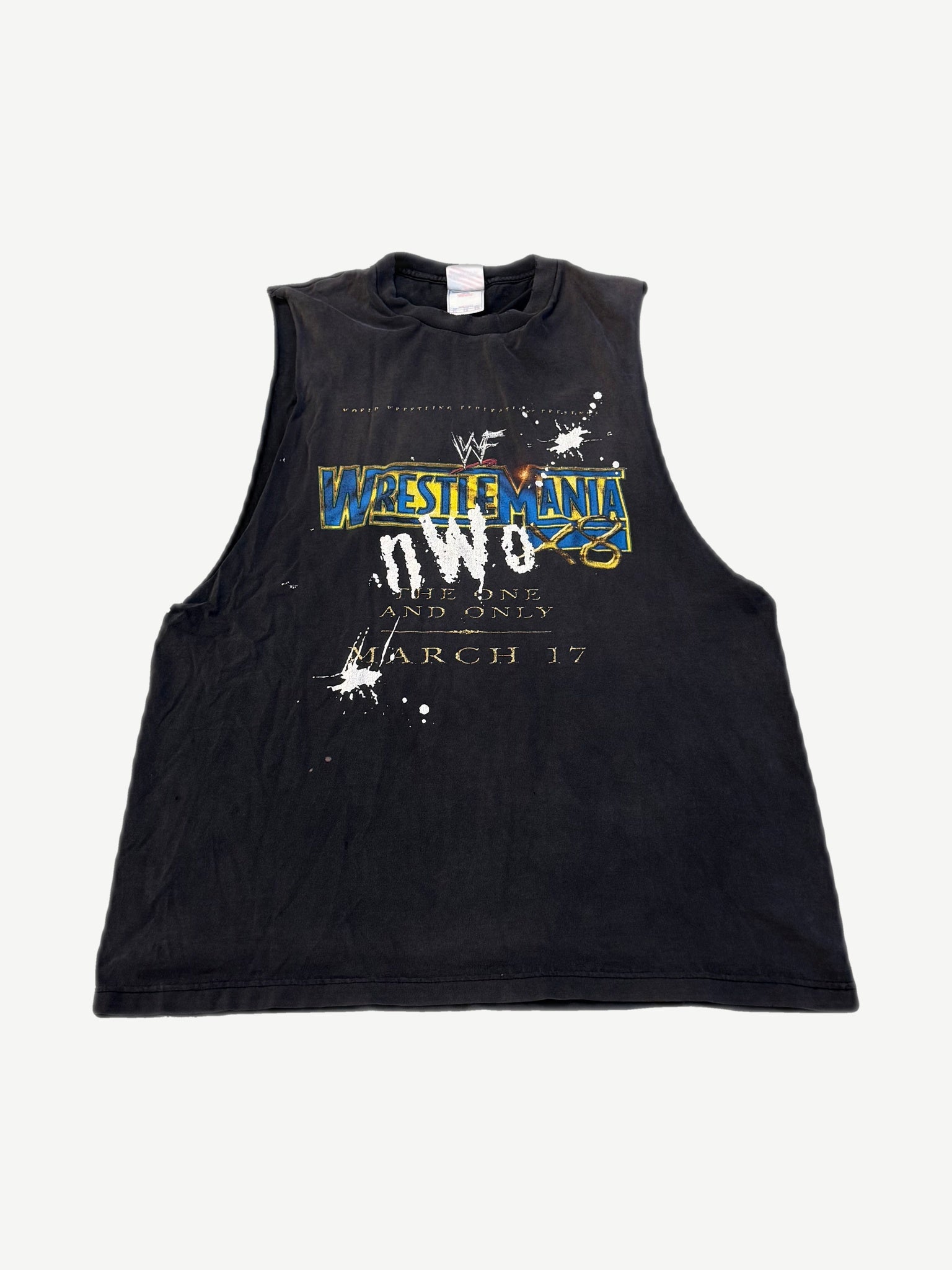 Vintage WWF Wrestlemania NWO cutoff sleeveless tee in faded black with yellow Wrestlemania logo print