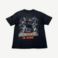 Vintage WWE John Cena The Champ is Here black tee with orange caged ring graphic and wrestlers print, front